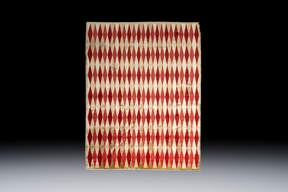 A hand-knotted woollen and silk carpet with a rhombic design, Ferdows, Iran, 20th C.