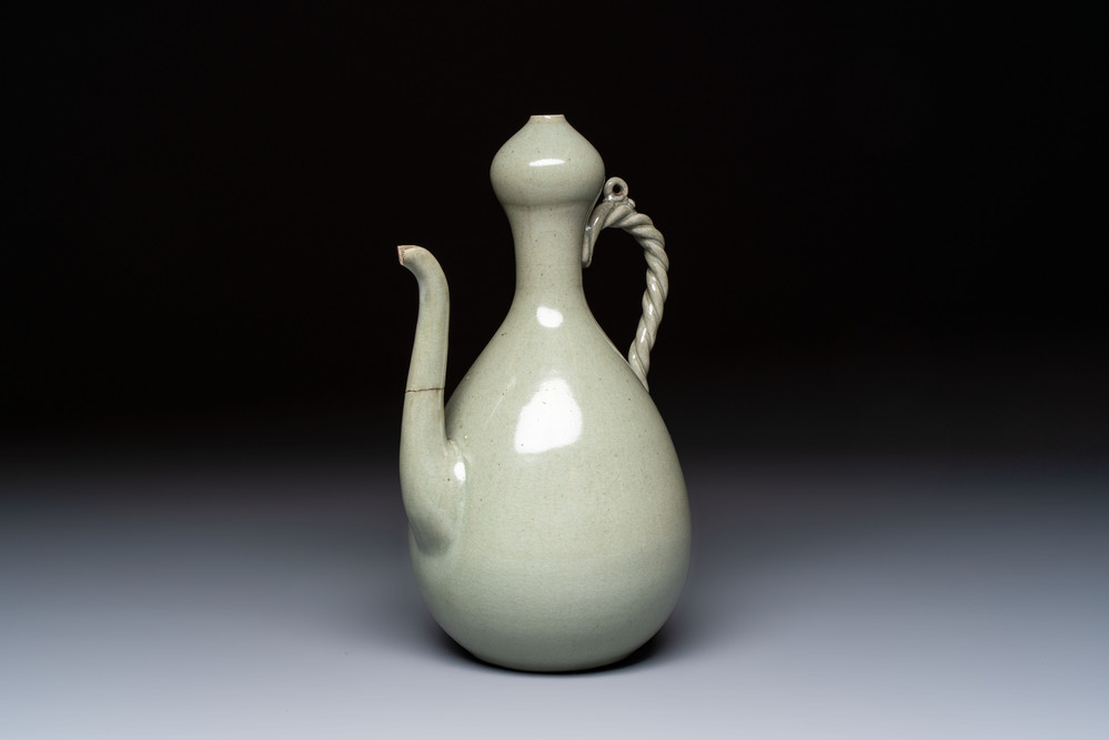 A Korean celadon-glazed ewer with twisted handle, 20th C.