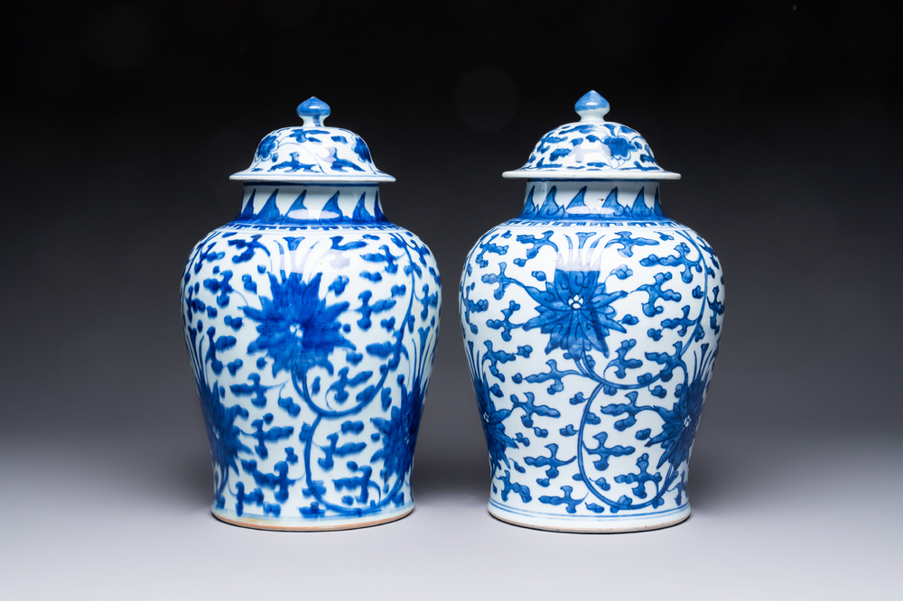 Two Chinese blue and white 'Lotus Scroll' vases and covers, Kangxi