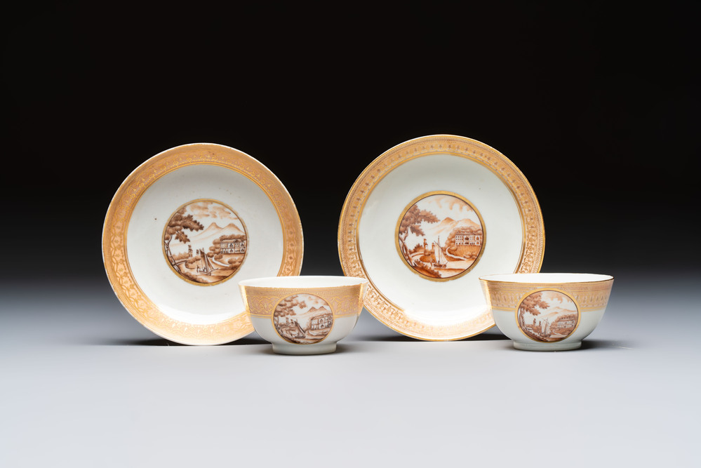 A pair of Chinese gilt-decorated sepia 'Riverscape' cups and saucers, Jiaqing