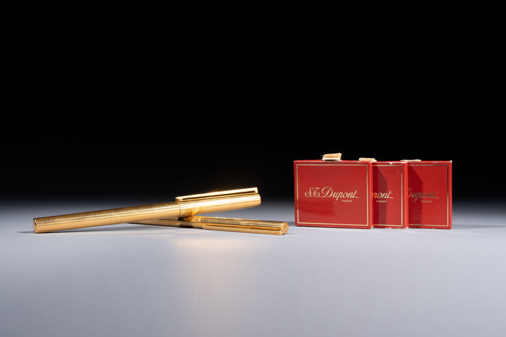 A gold-plated twist ballpoint pen and a fountain pen with an 18kt gold nib, S.T. Dupont Paris, France, 20th C.