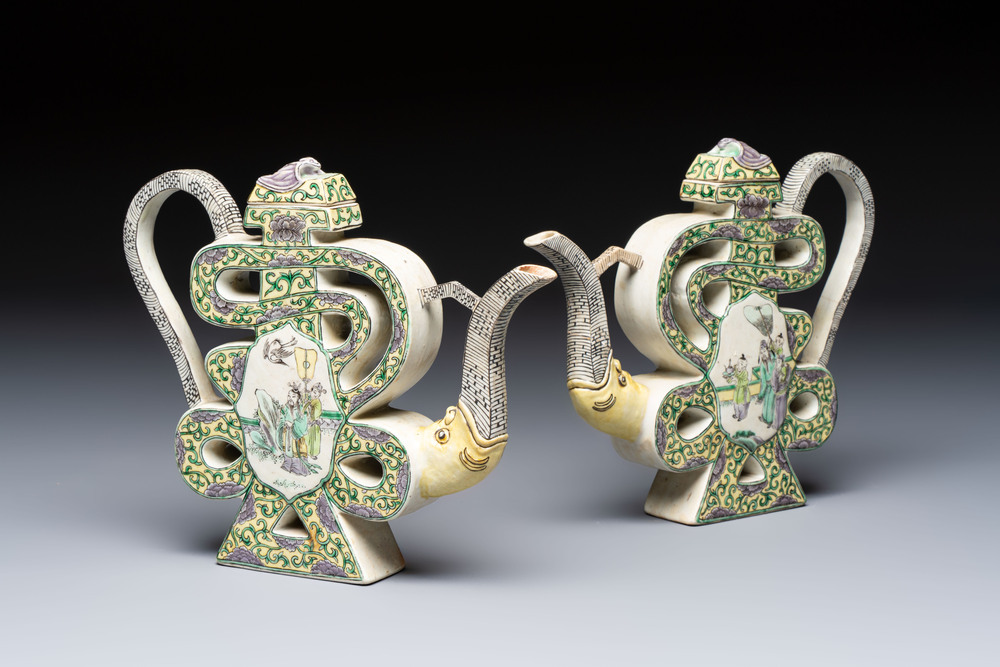A pair of Chinese verte biscuit 'Shou' wine ewers, 19th C.