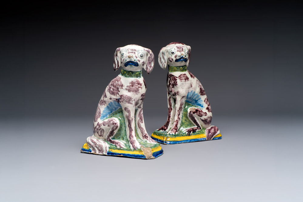 A pair of polychrome Dutch Delft money banks modelled as dogs, 18th C.