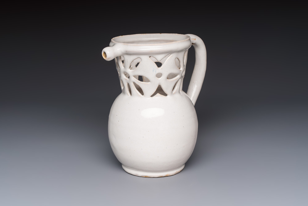 A French white-glazed puzzle jug, Nevers, 18th C.