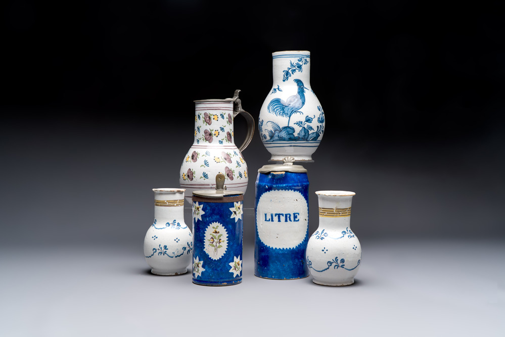 A varied group of six blue, white and polychrome Brussels faience jugs, 18th C.