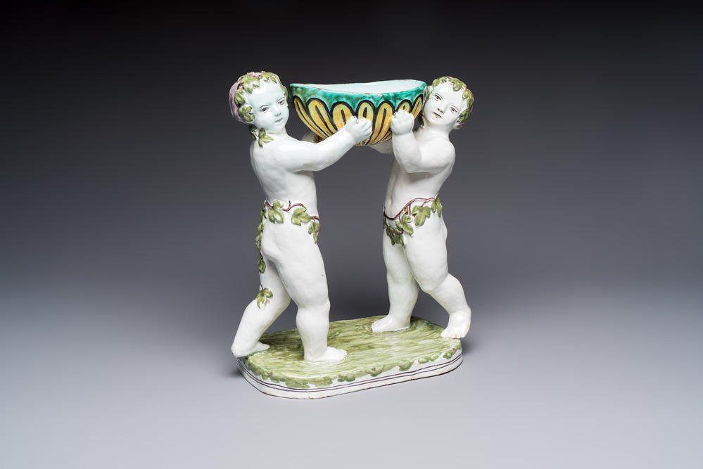 A French polychrome faience group with two Bacchus figures, Geo Martel, D&egrave;svres, early 20th C.
