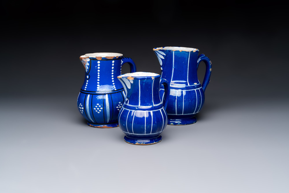 Three blue-ground faience jugs, probably Saint-Omer, North of France, 18/19th C.