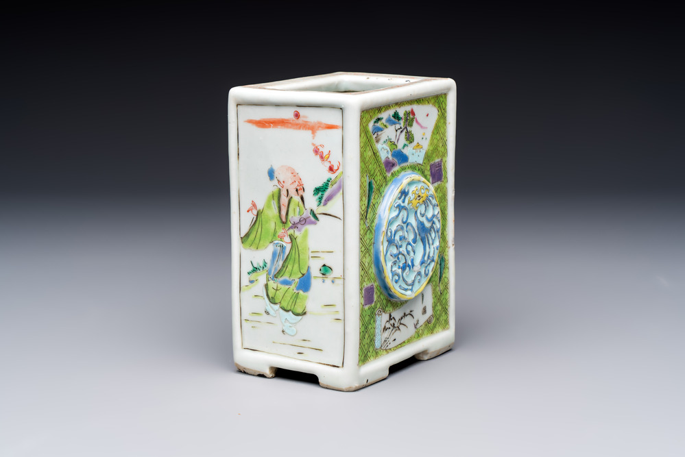 A Chinese famille rose relief-moulded rectangular brush pot with figural design, Yongzheng