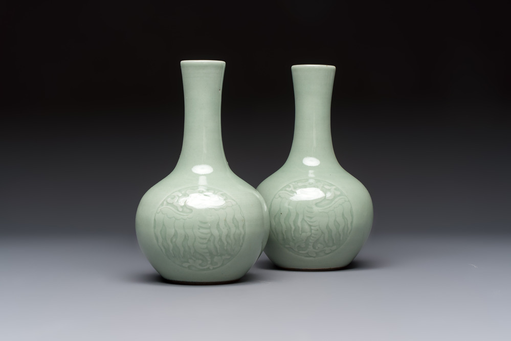 A pair of Chinese celadon-glazed bottle vases with incised phoenix design, Yongzheng mark, 19th C.