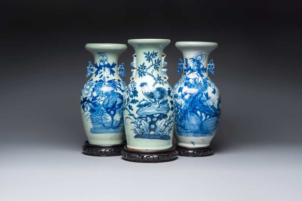 Two Chinese blue and white celadon-ground vases and a blue and white vase, on wooden stands, 19th C.