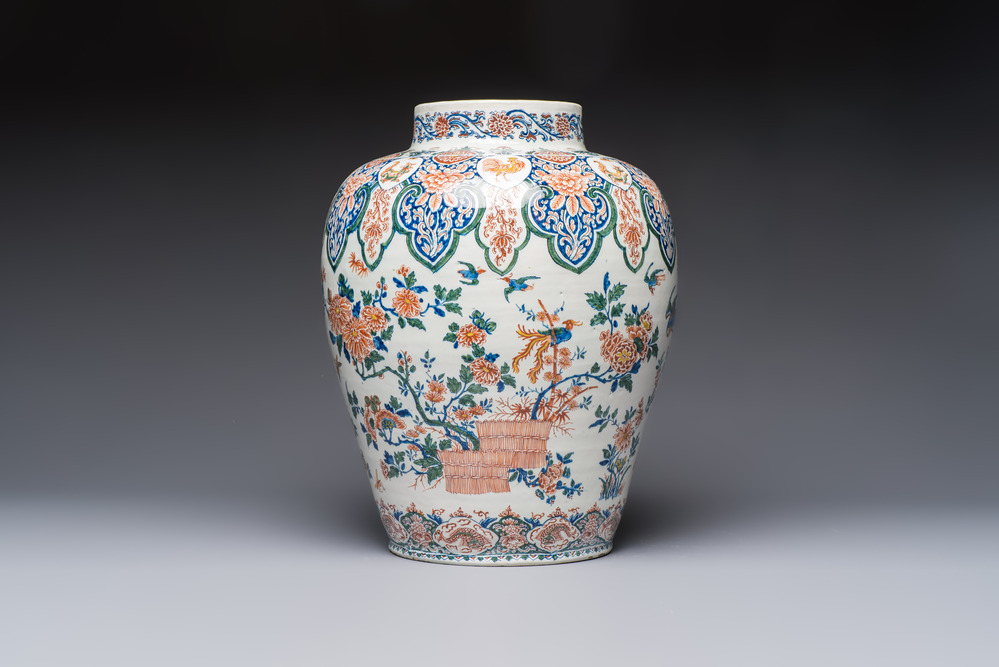 A large Dutch Delft cashmere palette vase with a phoenix and birds among flowers, ca. 1700