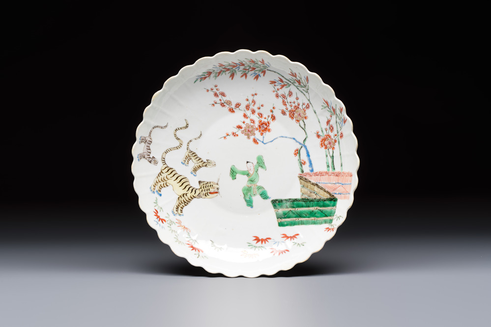 A Chinese famille verte Kakiemon-style 'Boy and Tigers' lobed dish, Kangxi