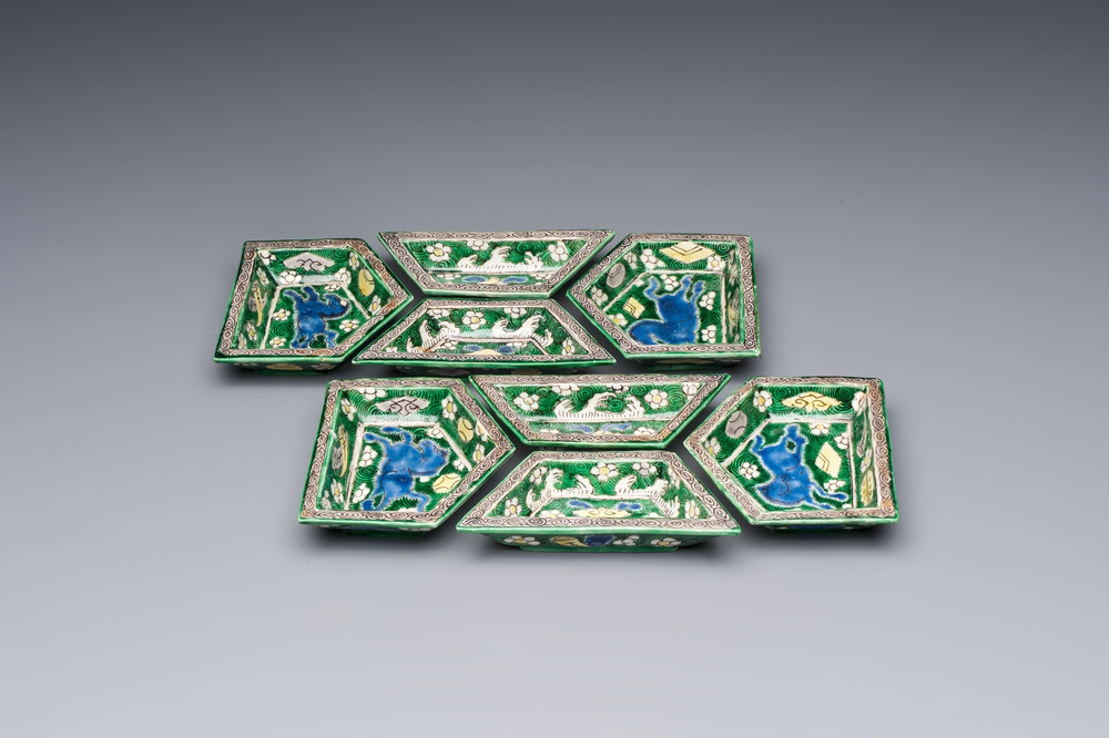 A Chinese verte biscuit eight-piece sweetmeat set with flying horses, 19th C.