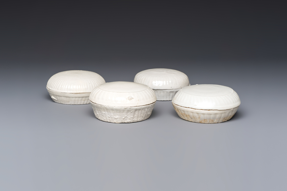 Four Chinese white-glazed boxes and covers with incised floral design from the Jepara shipwreck, Dehua or Anxi kiln, Song