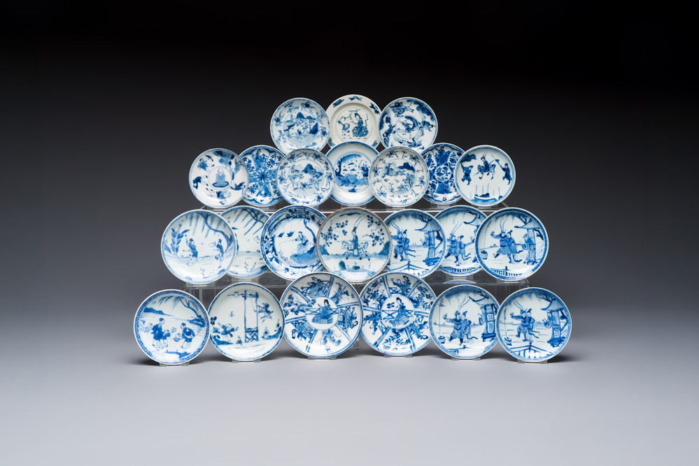 23 Chinese blue and white saucers with figural design, Yongzheng/Kangxi