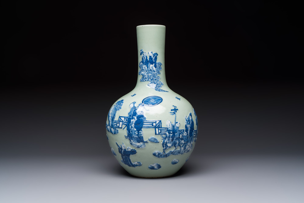 A Chinese blue and white celadon-ground 'Sanxing' bottle vase with relief design, 19th C.