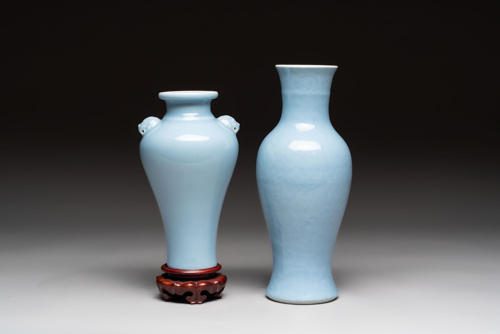 Two Chinese claire-de-lune vases, one with a wooden stand, Kangxi and Yongzheng mark, 19/20th C.
