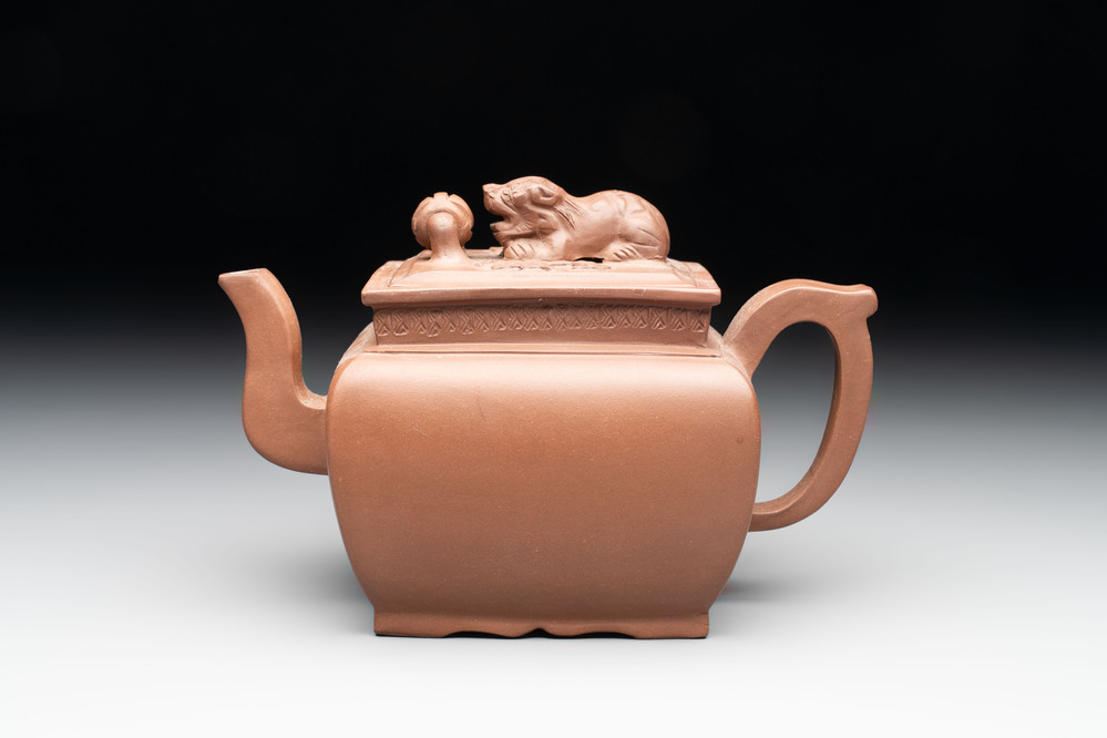 A Chinese Yixing stoneware 'lion and brocade ball' teapot and cover, 19/20th C.