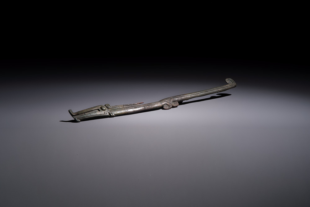 A large Chinese archaic bronze dragon-shaped fitting, early Western Zhou