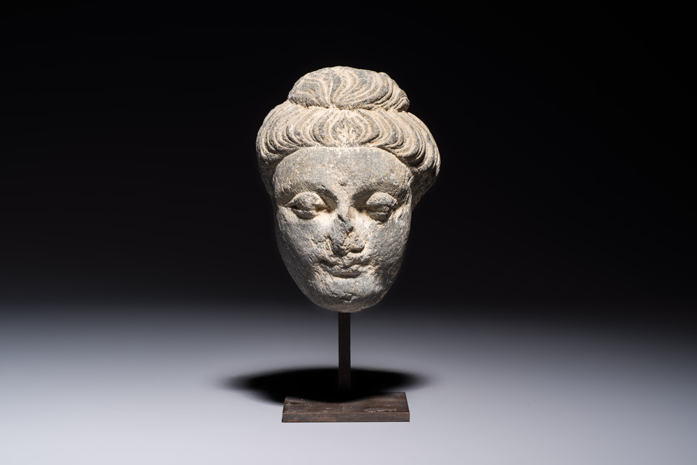 A Gandhara grey schist relief fragment of a Bodhisattva head, 3rd/4th C.