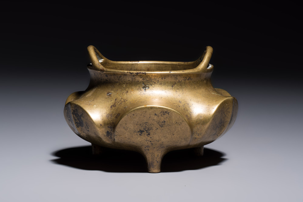 A Chinese bronze flower-shaped tripod censer with handles, Xuande mark, 19th C.