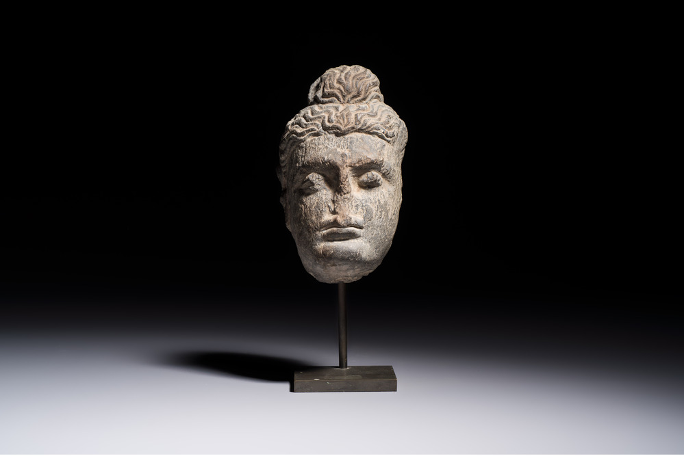 A Gandhara grey schist relief fragment of a Bodhisattva head, 3rd/4th C.