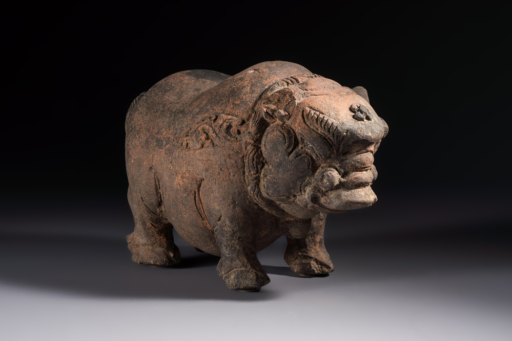A Javanese terracotta boar-shaped money bank, probably Majapahit Kingdom, 15th C.