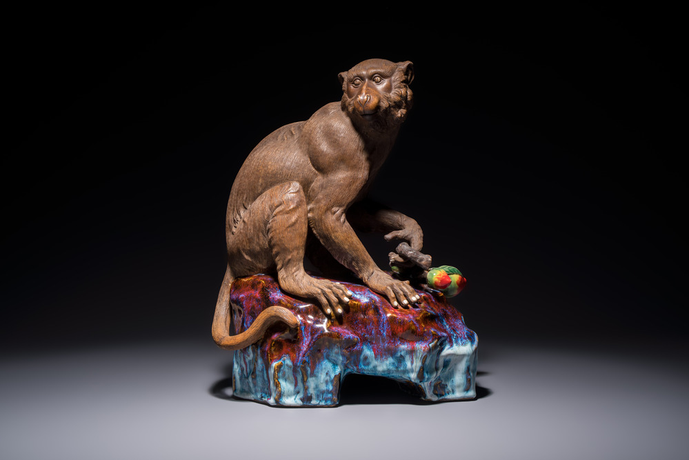 A Chinese polychrome-glazed Shiwan stoneware 'Monkey and Peach' group, signed, 20th C.