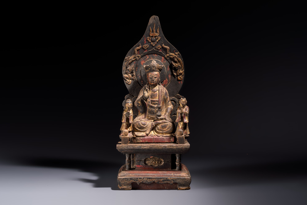 A Chinese gilt-lacquered wooden Bodhisattva and attendants on a throne, Qing
