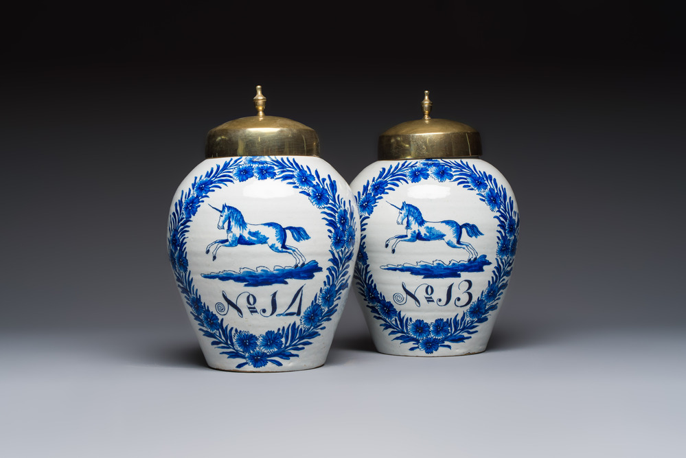 A pair of blue and white Dutch Delft 'Leaping Unicorn' tobacco jars, 18th C.