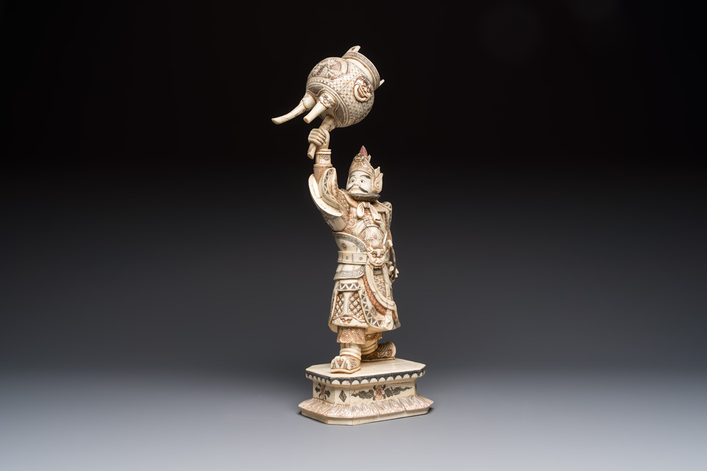 A Chinese polychromed carved bone figure of a warrior raising a tripod censer, 20th C.