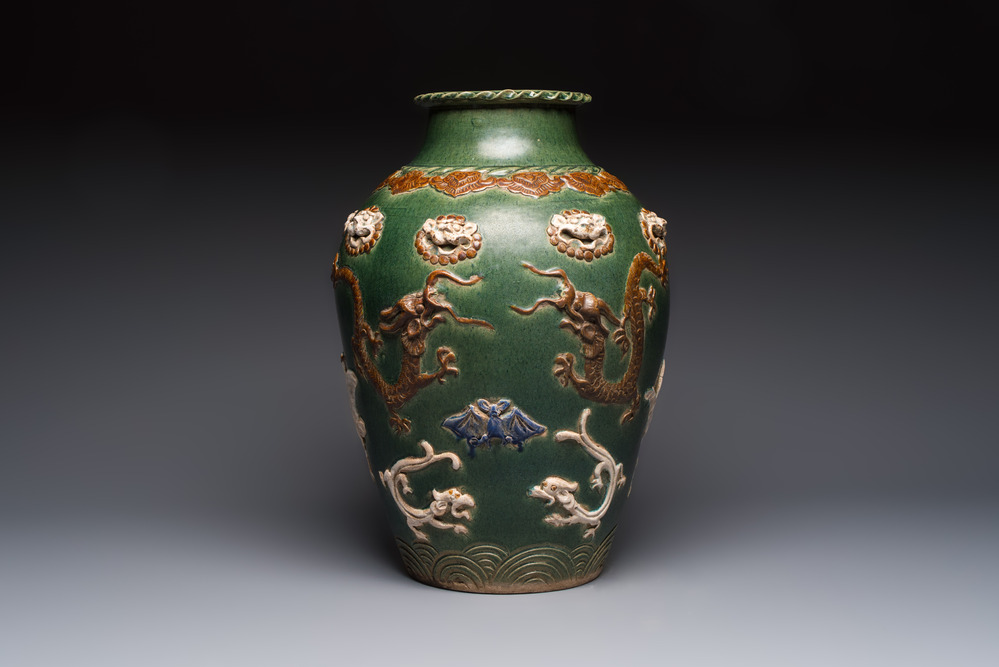 A Chinese sancai-glazed martaban with relief design, 19th C.
