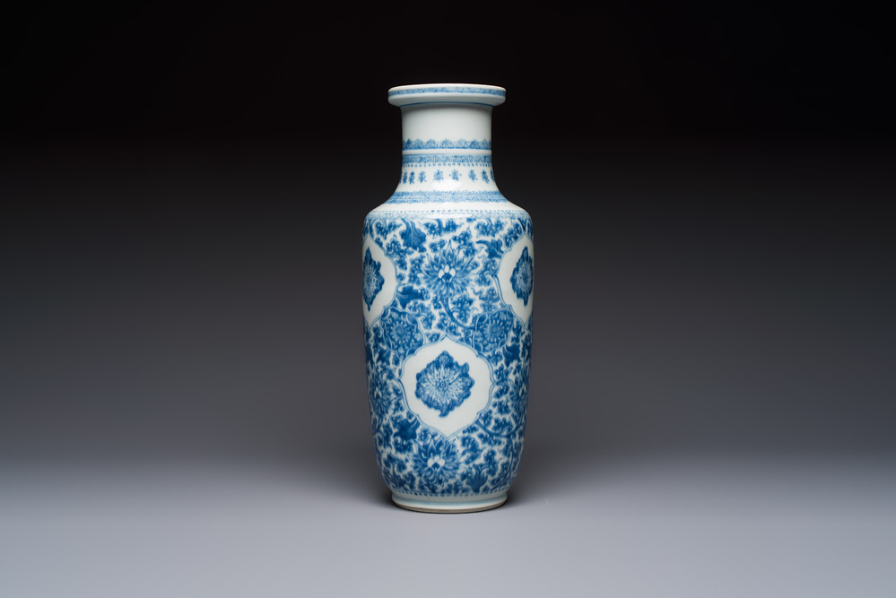 A Chinese blue and white rouleau vase with floral design, Kangxi
