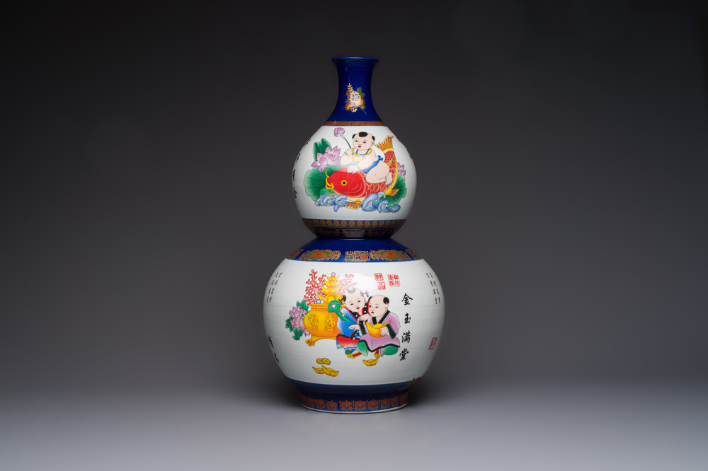 A large Chinese polychrome-decorated blue-ground double-gourd vase, 20th C.