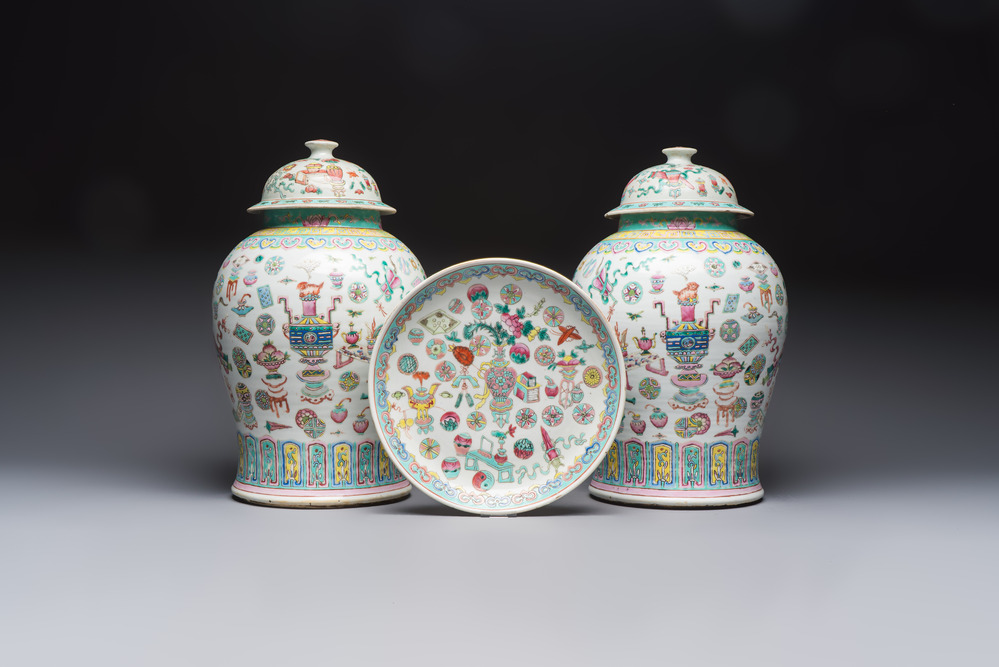 A pair of Chinese famille rose 'Antiquities' covered vases and a dish, 19th C.