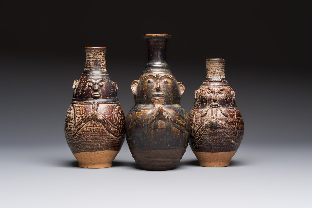 Three khmer-style brown-glazed anthropomorphic gourd-form bottles, probably 12/13th C.
