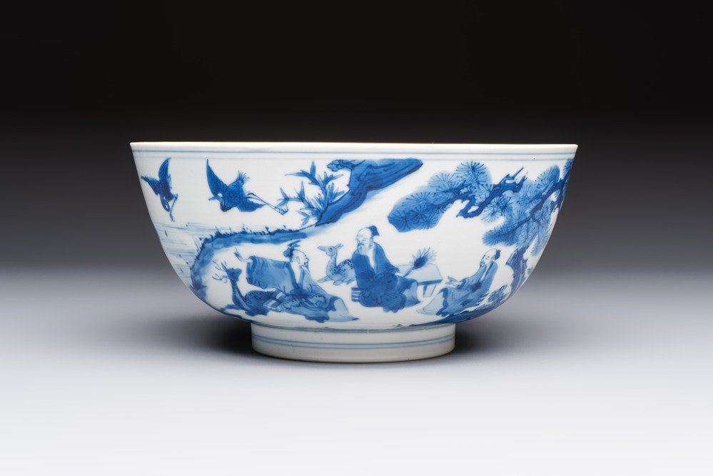 A Chinese blue and white bowl with scholars among cranes and deer, Kangxi mark and of the period