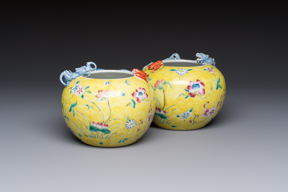 A pair of Chinese famille rose yellow-ground water pots with floral design and applied chilong and bats, Qianlong mark, 19/20th C.