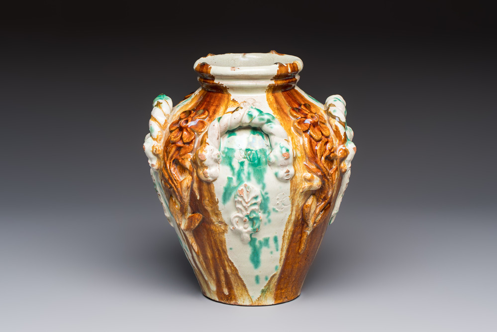 A polychrome Saintonge pottery vase with rope twist handles and mascarons, France, 17th C.