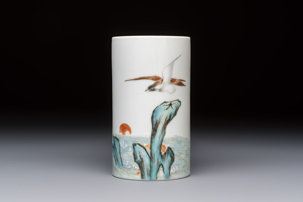 A Chinese polychrome brush pot with a bird standing on rockwork amid waves, Qianlong mark, 20th C.