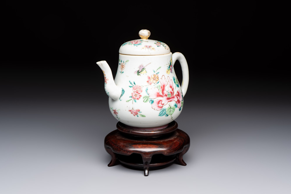 A Chinese famille rose 'Birds and Insects among Flowers' teapot on a later wooden stand, Yongzheng