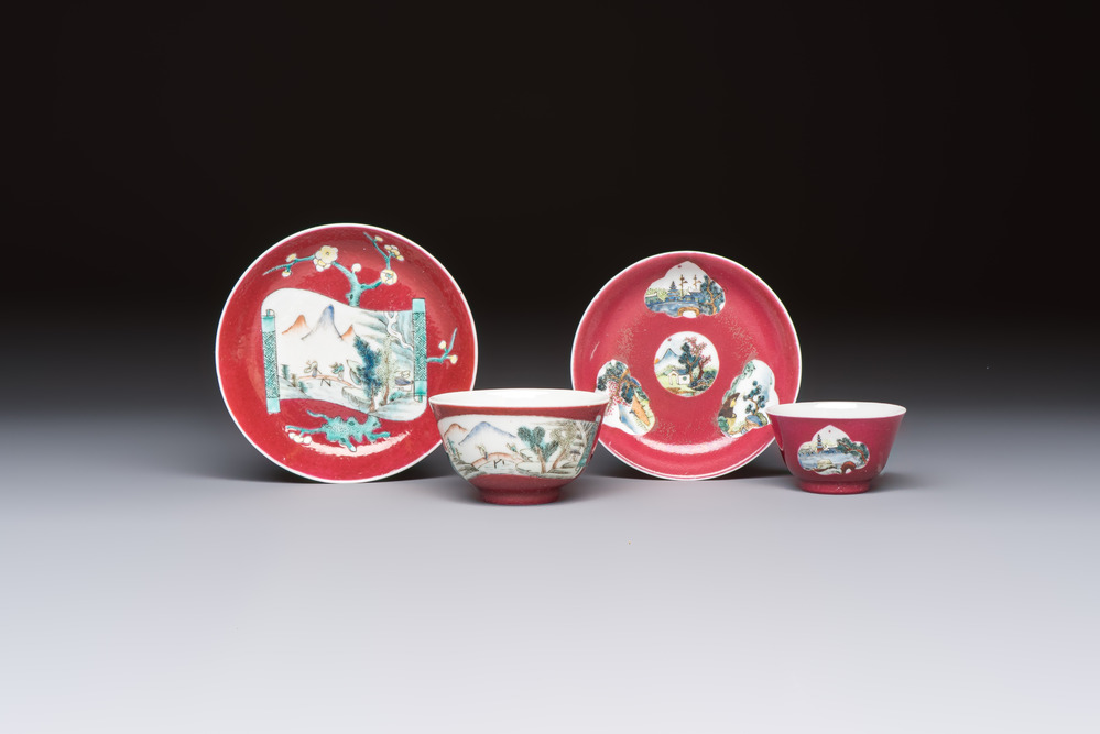 Two Chinese famille rose ruby-ground 'Landscape Scroll' cups and saucers, Yongzheng