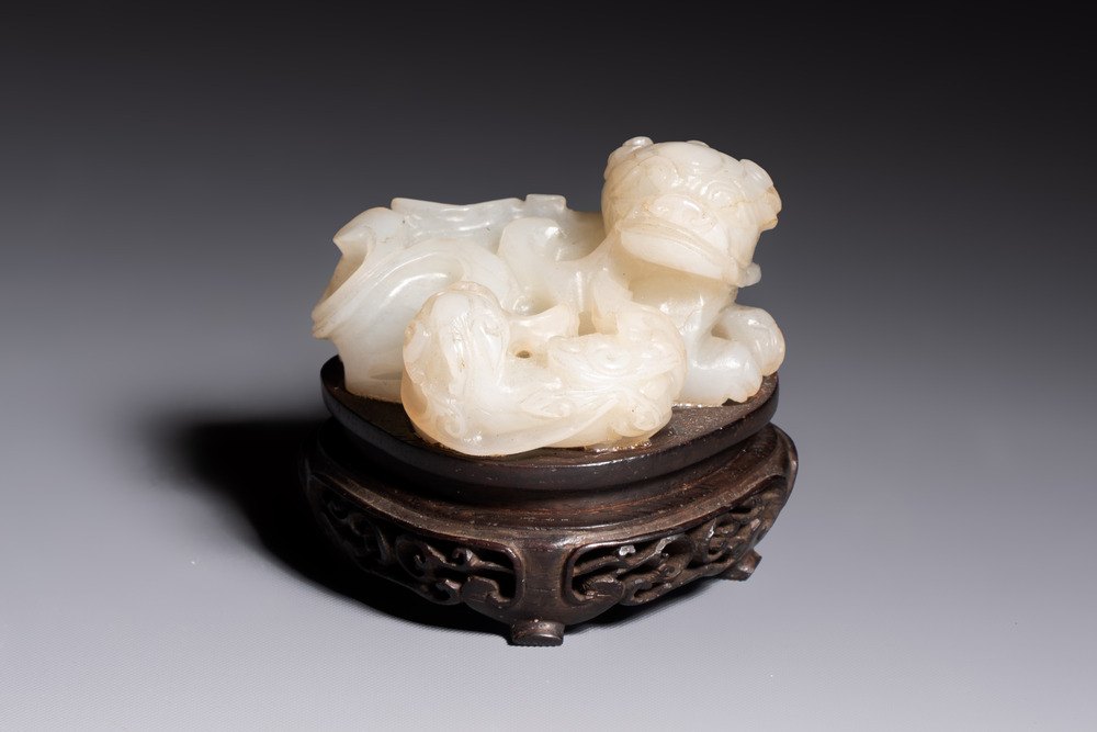 A Chinese carved jade 'Buddhist Lions' group, 19th C.