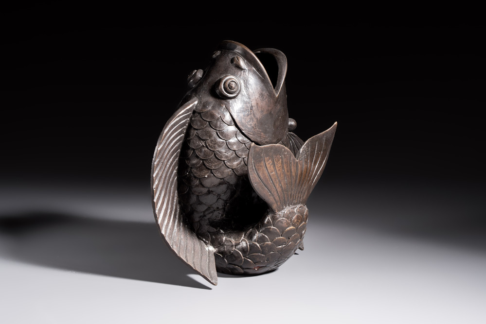A Chinese or Japanese bronze carp-form vase, 19/20th C.