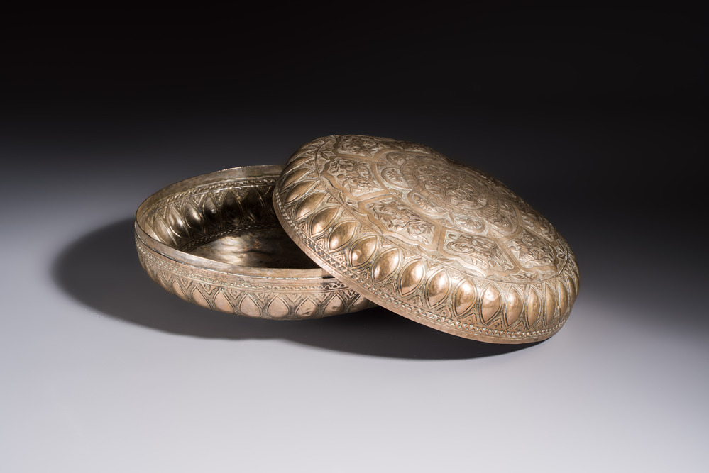 A Malay silver circular betel box and cover with floral design, 19th C.