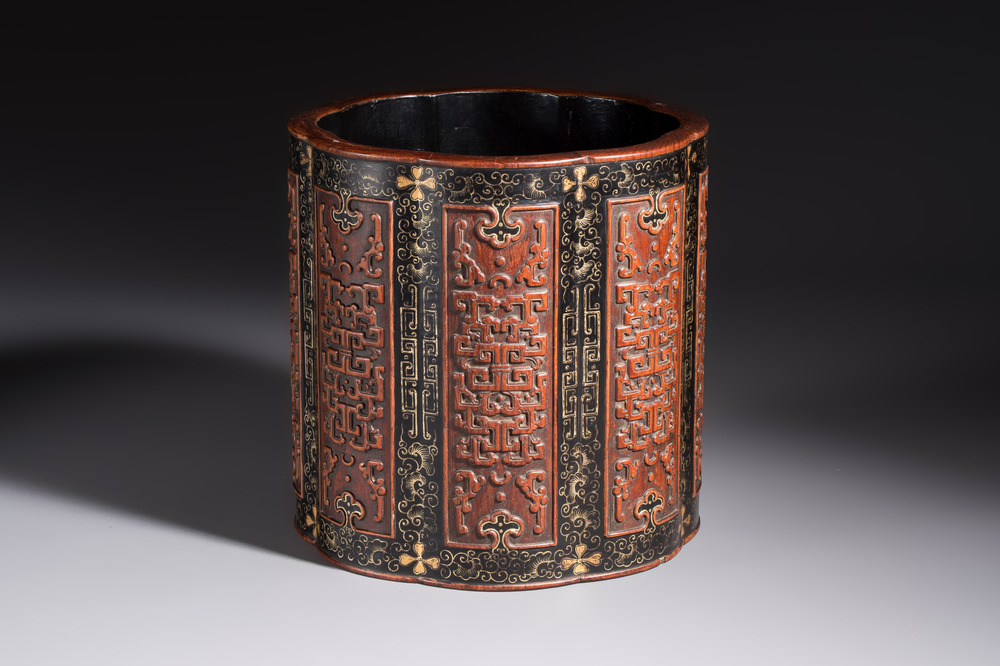 A Chinese gilt black-lacquered huanghuali brush pot with chilong design, Kangxi/Yongzheng
