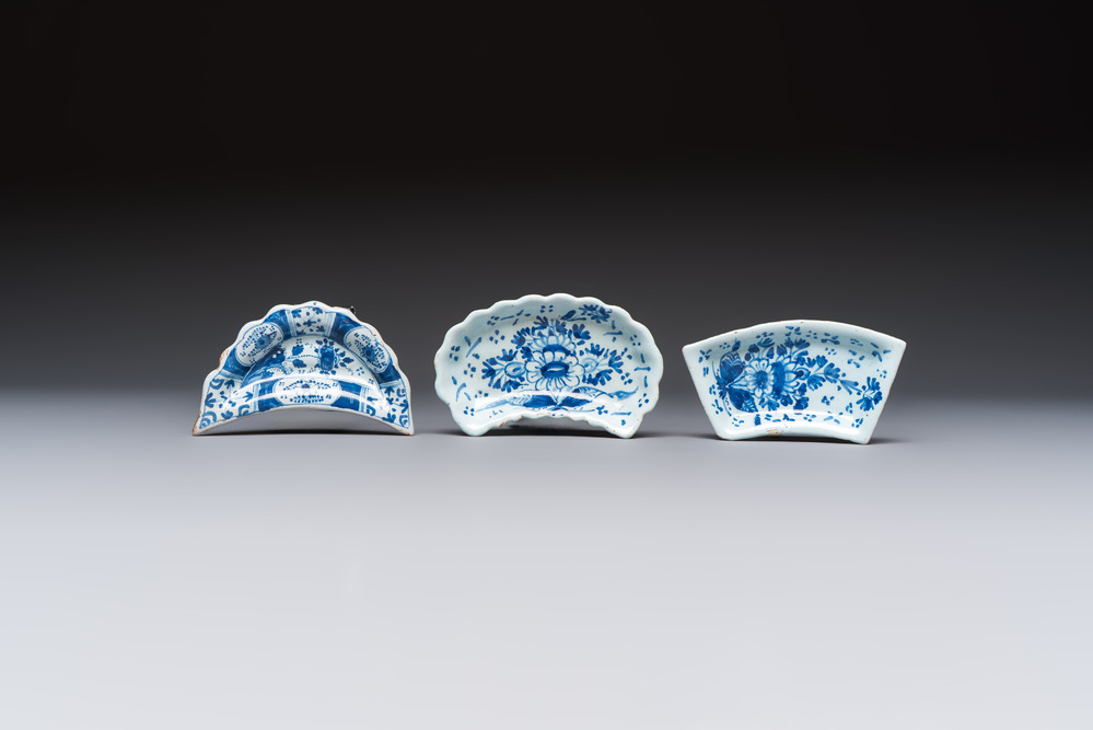 Two blue and white English Delftware condiment plates and a German N&uuml;rnberg example, 18th C.