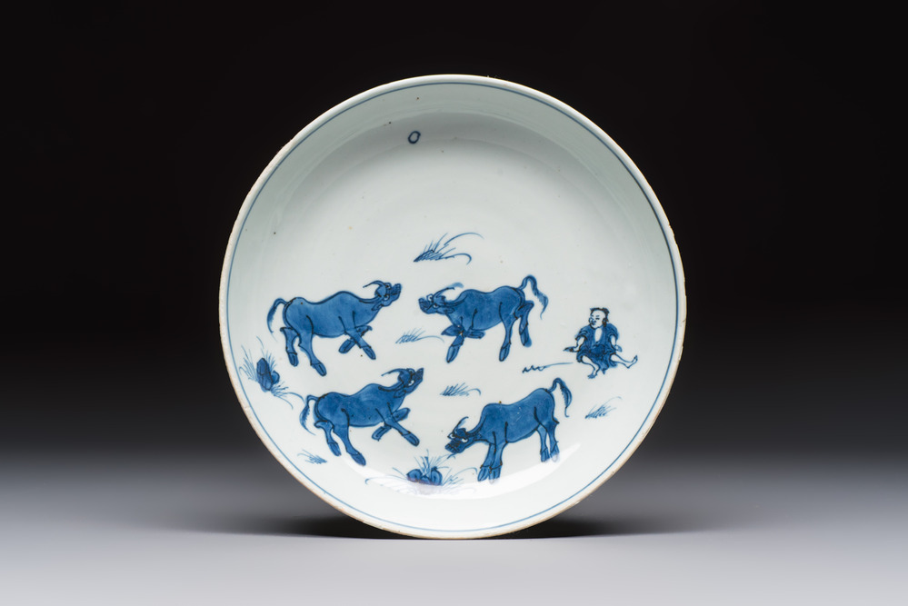 A Chinese blue and white ko-sometsuke 'Buffalo Herder' plate for the Japanese market, Tianqi
