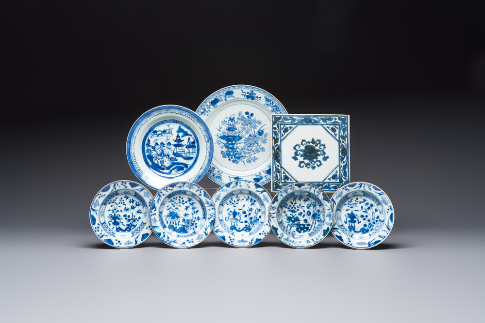 Six Chinese blue and white plates, a dish and a large tile, Yongzheng/Qianlong