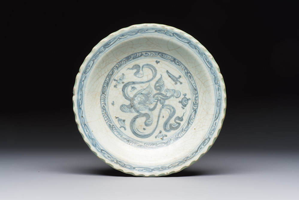 An unusual Chinese blue and white celadon-back 'Buddhist Lion' plate, Ming